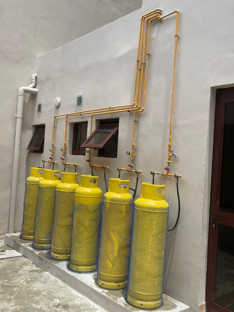 Professional gas piping installation in Nigerian commercial kitchen with certified technicians